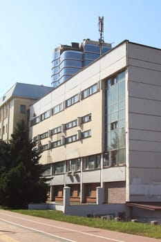 A grand and substantial building featuring an impressive tower situated atop it, making it a notable landmark in the skyline