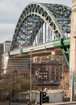 Newcastle, UK - Apr 11, 2025 - A view of Tyne Bridge featured at a dynamic angle showing the parabolic arch of the bridge spanning spanning the River Tyne in Newcastle Upon Tyne in the North East of England. use it as your Wallpaper, Poster and Space for text, Selective focus.