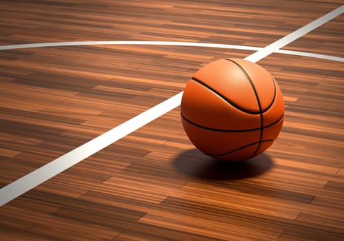 An official orange basketball ball on a hardwood basketball court
