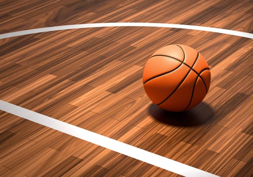 An official orange basketball ball on a hardwood basketball court
