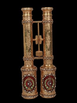this image features a pair of ornate, gold-toned british field glasses from the second half of the 19th century. the antique binoculars showcase intricate detailing, possibly with jewel accents in red, white, and green, reflecting a luxurious and historical design. ideal for projects related to vintage collectibles, historical instruments, and elegant optical devices.
