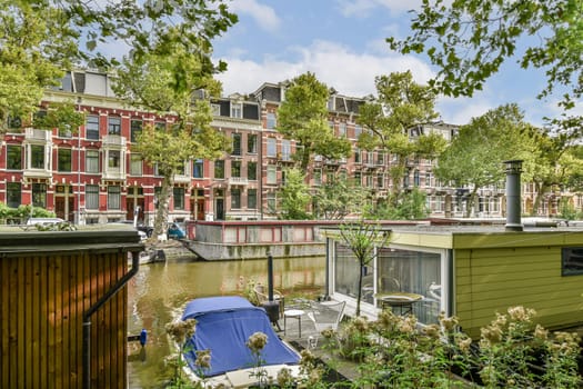 A picturesque scene featuring vibrant, historic buildings lining a serene canal, surrounded by lush greenery and a tranquil atmosphere.