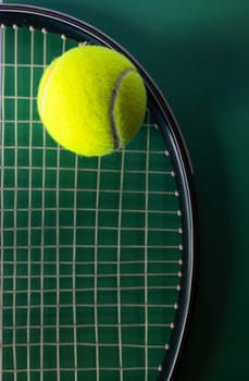 Tennis balls on dark green background, flat lay. Isolated. Top view.Copy space.Promotional background for tennis sport. Real vertical picture