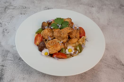 A flavorful blend of chicken, linguine, shiitake mushrooms, bell peppers, and fresh garden flowers offers a vibrant and appetizing meal. Ideal for a cozy dinner or gathering.