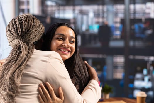 Powerful satisfied entrepreneurs hugging and congratulating each other after hard work and dedication, achieving great things together in a men dominated business industry, success story.