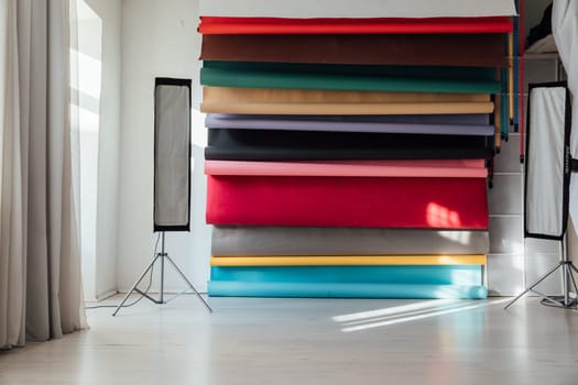 Backgrounds and equipment for the photographer's work in the interior of a photo studio
