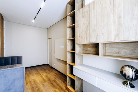 In the center of the room, on the shelf, there is a notable globe that draws attention from anyone who enters the space