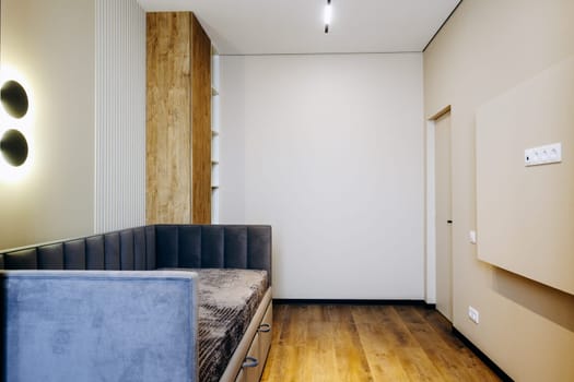 In the center of the room, there is a large couch positioned. It serves as a focal point for the space and adds comfort and style