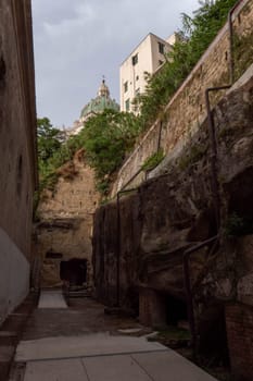 The Catacombs of San Gennaro are underground paleo-Christian burial and worship sites in Naples, Italy, carved out of tuff, a porous stone.