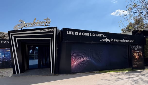 Budva, Montenegro - April 17, 2025: Closed entrance to the AMBIENTE nightclub on the Budva waterfront