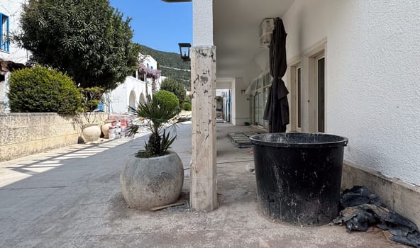 Budva, Montenegro - April 17, 2025: On the exterior of the renovated MAGNOLIA Healthy Bar building, thickets of plants and debris are visible, highlighting the theme of the renovation.