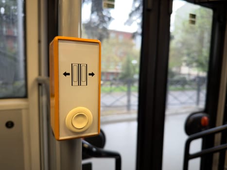 Close up of door open button in modern public transport, representing smart and accessible urban mobility solutions in contemporary city infrastructure