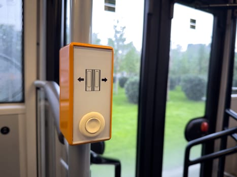 Passenger access button for opening doors in public transport, designed for ease of use and inclusivity, enhancing the comfort of daily commuting for all