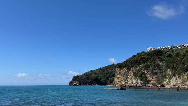 Budva, Montenegro - April 18, 2025: Coastal landscape showcasing cliffs and clear waters, embodying tranquility and natural beauty in a serene environment