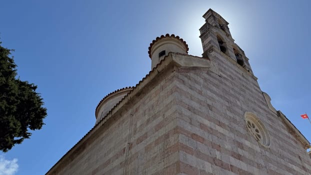 Budva, Montenegro - April 20, 2025: Historic Holy Trinity Church in the Old Town, known for its beautiful architecture and cultural significance