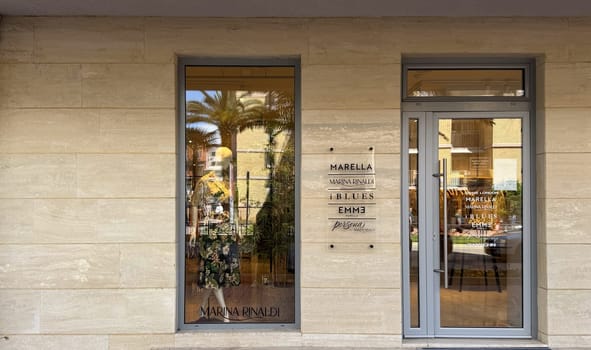Budva, Montenegro - April 18, 2025: Front door of Marina Rinaldi Boutique. elegant fashion and a welcoming concept