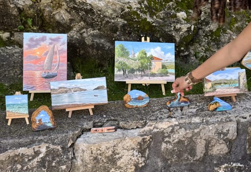 Budva, Montenegro - April 18, 2025: An exhibition of the artist's coastal paintings showcasing creativity and the concept of inspiration