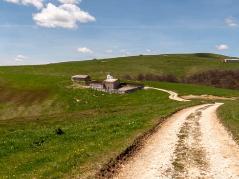 Italian hut in mountain landscape - Mountain Lessini Verona Northern Italy High quality photo