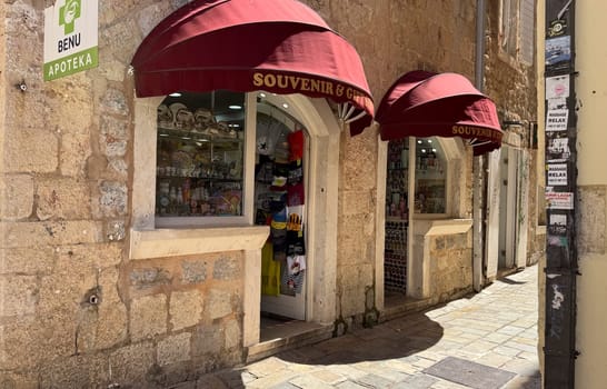 Budva, Montenegro - April 18, 2025: A charming souvenir shop located in the historic stone alley of the Old Town, featuring local handicrafts and cultural objects