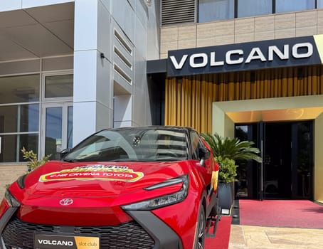 Budva, Montenegro - April 18, 2025: Red Toyota car as a prize installed at the entrance of the Vulkan gaming club