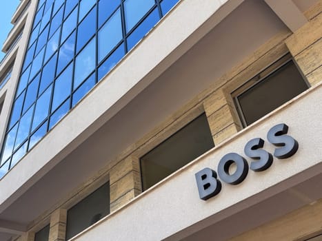 Budva, Montenegro - April 18, 2025: BOSS logo on the canopy of the building.