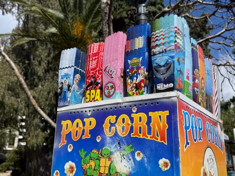 Budva, Montenegro - April 18, 2025: Colorful popcorn boxes displayed outdoors highlight popular characters and themes, creating a fun atmosphere for visitors and families