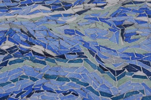 Blue art ceramic mosaic on the floor, mosaic background. colorful mosaic. texture mosaic.