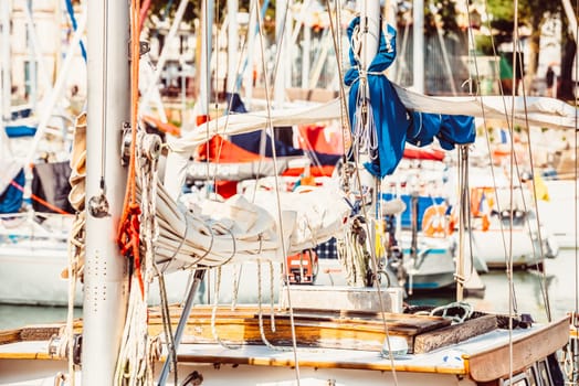 Sailboats in marina with rigging details and vibrant colors, background