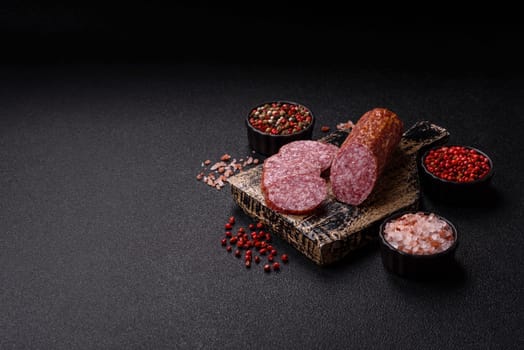 Sliced salami sausage, smoked meat, delicious deli snacks on a plate