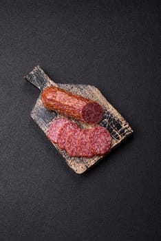 Sliced salami sausage, smoked meat, delicious deli snacks on a plate