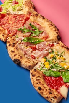 Four slices of delicious gourmet pizza with various toppings, creating a visually appealing culinary experience