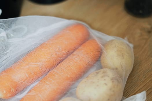 Zero waste food shopping. Fruit and vegetables in cotton bags, potato,carrot Healthy food, clean eating, eco friendly, no plastic. High quality photo