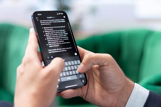 Bucharest, Romania - July 30th 2024 - Man typing prompts into an AI powered chat on his smartphone app, advanced virtual assistant showcases smart solutions for task completion.