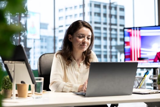 Determined female director sets targets for the company expansion plan, demonstrating her leadership skills and commitment to satisfying results and business objectives. Success story.