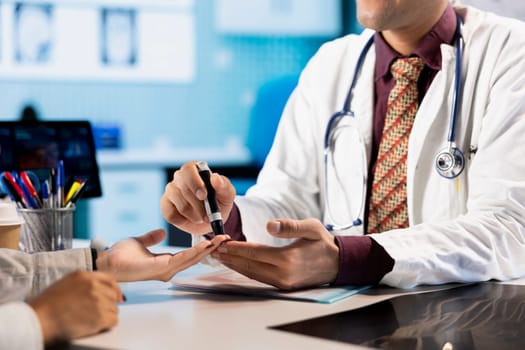 Medical consultation with physician using an insulin injector for a patient suffering from diabetes, diagnostics and treatment. Indian doctor using insulin pen in a modern healthcare facility.