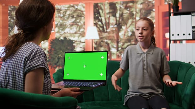 Therapist uses green screen display in a counseling session with an adolescent dealing with low confidence. Psychotherapist supports her in building resilience and self esteem. Camera B.