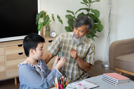 A heartwarming scene of a teenage girl with Down syndrome sharing a creative moment with her grandfather, as they explore art and learning together in a cozy home environment.