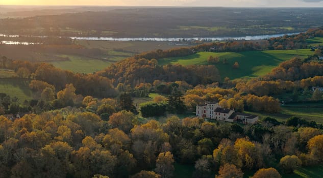 France, Gironde, Tabanac, Aerial view of the vineyard and wooded areas of Chateau le Pic in the Bordeaux vineyards at sunset. High quality photo