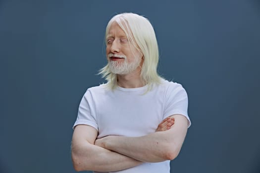 A calm elderly gentleman with flowing white hair and a beard, dressed in a simple white t shirt The subtle blue background enhances the peaceful ambiance, reflecting a sense of contemplation and wisdom