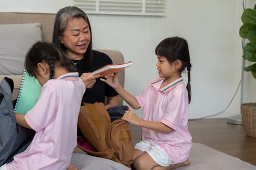 A loving grandmother engages with her grandchildren, sharing stories and knowledge, fostering a nurturing learning environment at home.