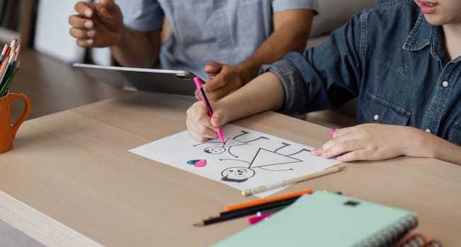 A grandfather helps his grandson with drawing, providing guidance and support in a nurturing environment, illustrating the importance of family connection through creative activities.