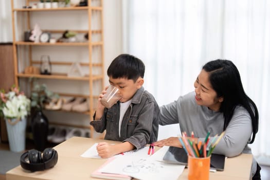 A mother helps her son get ready for school, ensuring he has everything he needs while enjoying their time together. The image captures the essence of family support and education.