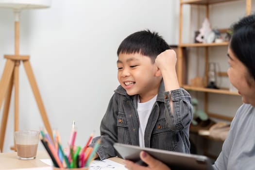 A cheerful child expresses joy and excitement while interacting with a parent, showcasing the importance of encouragement and support in learning.