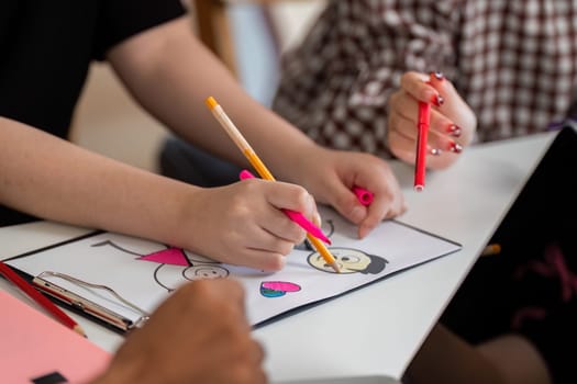 Young learners express their creativity through art, highlighting collaboration and the joy of learning in a diverse setting.