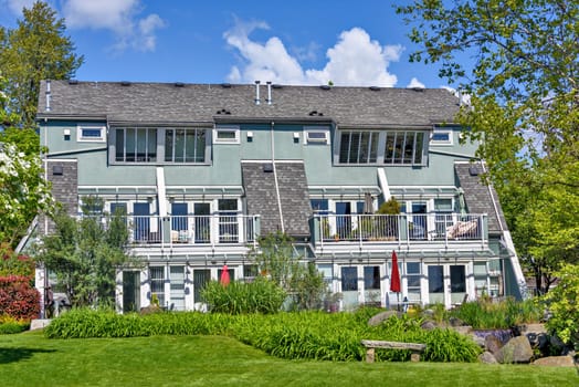 Quadruplex residential building on sunny summer day in British Columbia