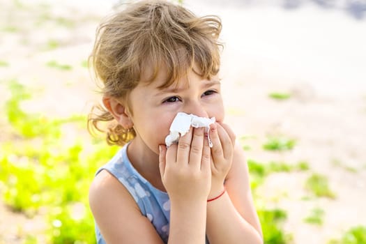 child allergic to flowering trees. Selective focus. kid.