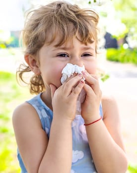 child allergic to flowering trees. Selective focus. kid.