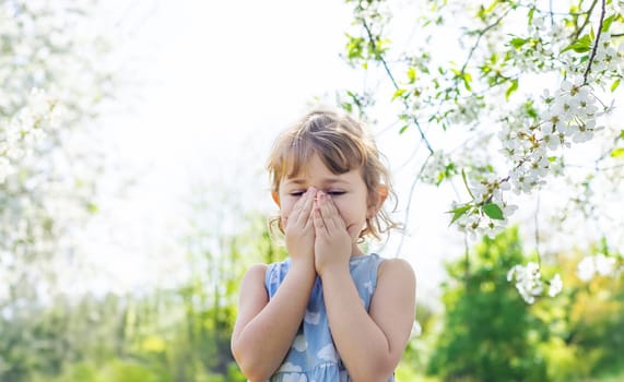child allergic to flowering trees. Selective focus. kid.