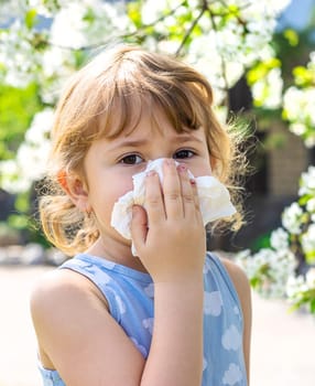child allergic to flowering trees. Selective focus. kid.
