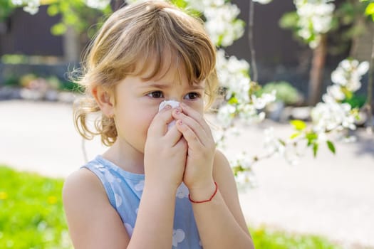 child allergic to flowering trees. Selective focus. kid.